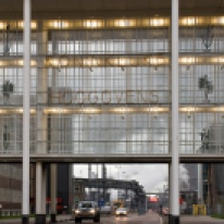 Kantoorgebouw, Velsen (office building). This illustrates Dudok's diversity and lack of dogmatic attachment to his supposed style. This transparent sliver bridges over a road linking two separate parts of the office block while creating an urban gate.